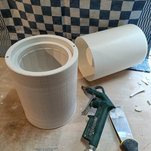 Handmade ceramic vessels from studiofijf, showcasing authentic pottery craftsmanship. Unique cylindrical forms hint at artisanal techniques. Eco-conscious, creating beautiful, sustainable home decor.