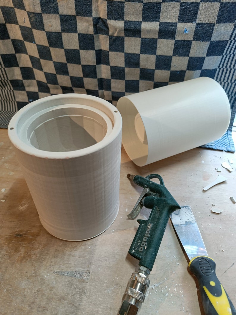 Handmade ceramic vessels from studiofijf, showcasing authentic pottery craftsmanship. Unique cylindrical forms hint at artisanal techniques. Eco-conscious, creating beautiful, sustainable home decor.