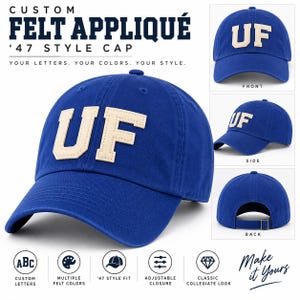 Puede incluir: Una gorra de béisbol azul real con letras de fieltro color crema UF en la parte delantera. La gorra se muestra desde ángulos frontal, lateral y posterior, con una correa de hebilla metálica ajustable. El texto incluye CUSTOM FELT APPLIQUÉ.