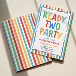 May include: A birthday invitation card and matching envelope featuring a colourful vertical stripe pattern in red, orange, yellow, green, and blue. The card displays the text READY TWO PARTY, JOIN US TO CELEBRATE MASON'S 2ND BIRTHDAY, and event details.