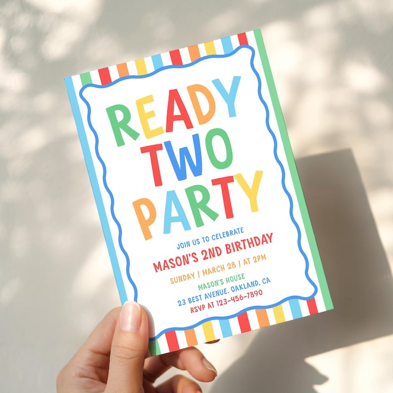 May include: A rectangular birthday invitation card featuring a colourful striped border and a wavy blue frame. The text reads READY TWO PARTY, JOIN US TO CELEBRATE MASON'S 2ND BIRTHDAY, SUNDAY | MARCH 28 | AT 2PM, MASON'S HOUSE, 23 BEST AVENUE, OAKLAND, CA, RSVP AT 123-456-7890.