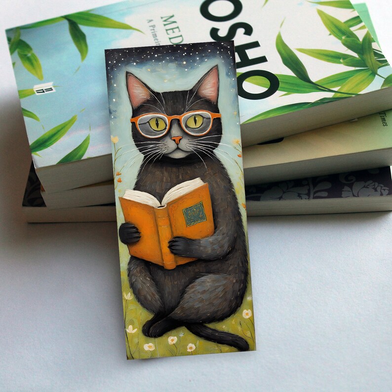 May include: A black cat wearing orange glasses sits on a green field and reads a yellow book with a gold design. The cat is surrounded by white flowers. The background is a blue sky with white stars.