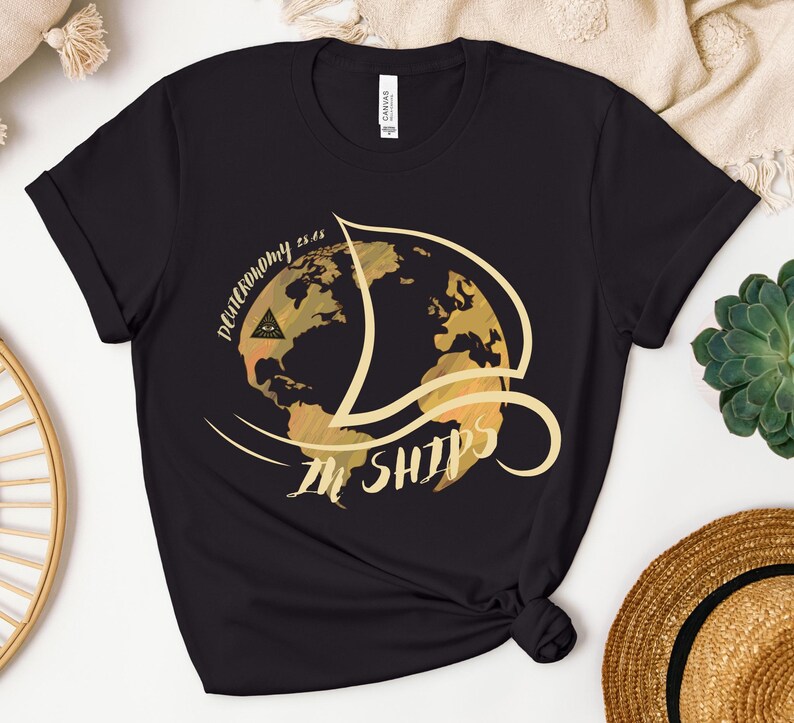 May include: Black t-shirt with a gold graphic of a globe with the text "Decononomy is in ships" on it.