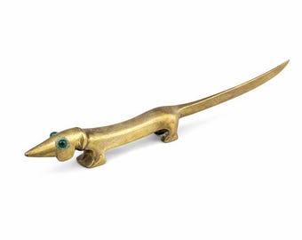 Vintage brass letter opener in the shape of a stylized dog, mid-20th century.