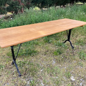 Large beech bistro coffee table and French cast iron base Paris bistro table 1950