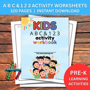 May include: A colorful activity workbook for kids with the title "KIDS ABC & 123 activity workbook". The cover features a group of cartoon children and the text "This book belongs to:". Includes crayons and the text "PRE-K LEARNING ACTIVITIES".