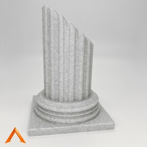 May include: A white, broken, stone column with a fluted top and a square base. The column is made of a textured material that resembles marble.