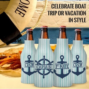 May include: Four blue and white striped bottle coolers with nautical designs. The coolers feature an anchor, a ship's wheel, and the text "Crew", "Captain", "1st Mate", and "Crew".
