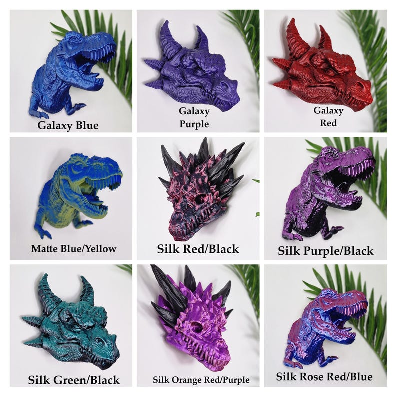 May include: Nine different colour variations of a 3D printed dinosaur and dragon figurine. The dinosaur is a Tyrannosaurus Rex and the dragon is a mythical creature with horns and spikes. The colours include galaxy blue, galaxy purple, galaxy red, matte blue/yellow, silk red/black, silk purple/black, silk green/black, silk orange red/purple, and silk rose red/blue.
