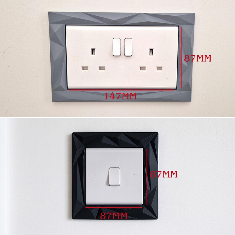 May include: A rectangular grey wall plate frame with a geometric faceted surface surrounding a white double electrical outlet, measuring 147mm by 87mm. Below, a square black faceted frame surrounds a white single light switch, measuring 87mm by 87mm.