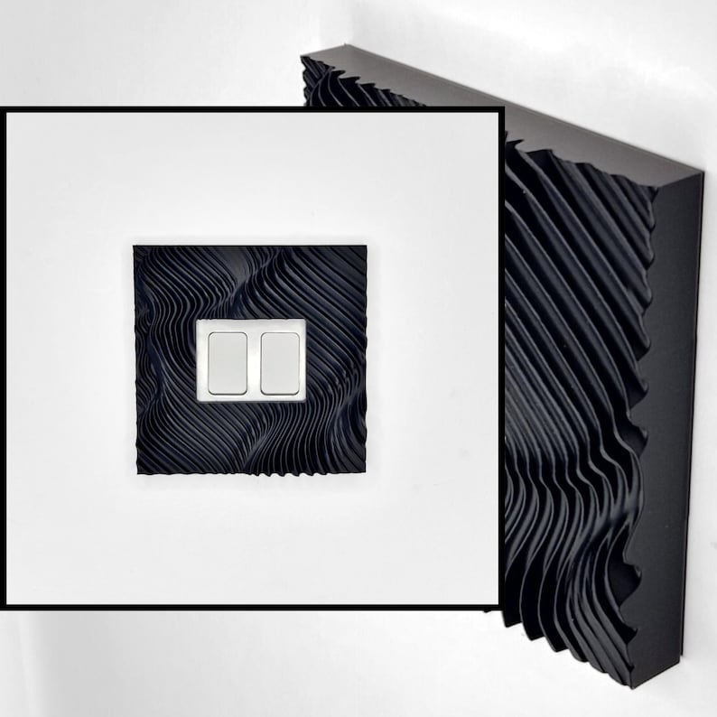 May include: A square black light switch cover featuring a textured, wavy, three-dimensional surface pattern. The cover includes two rectangular white toggle switches centered within the black frame, which has a deep, rippled, and ridged design.