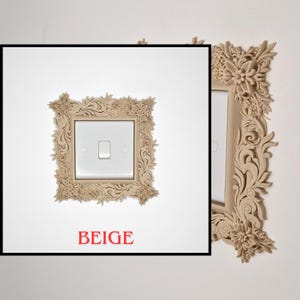 May include: Beige light switch cover with a floral design. The cover is square and surrounds a white light switch. The word "BEIGE" is printed in red at the bottom of the image. The design is detailed and ornate.