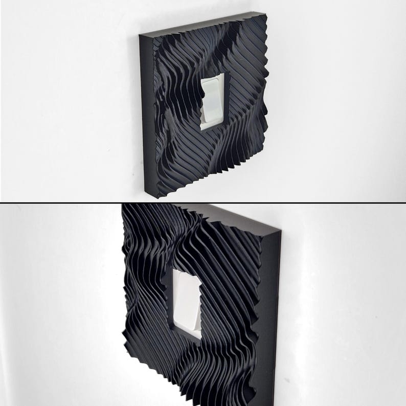 May include: A black light switch cover plate featuring a three-dimensional, wavy, rippled texture across its entire surface. The square-shaped cover has a central rectangular cutout that frames a standard white rocker-style light switch toggle.