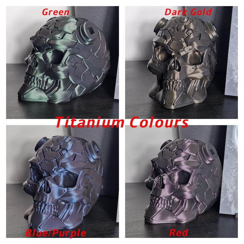 May include: Four 3D printed skulls in different metallic colours: green, dark gold, blue/purple, and red. The skulls are detailed and have a textured surface. The image is titled "Titanium Colours".
