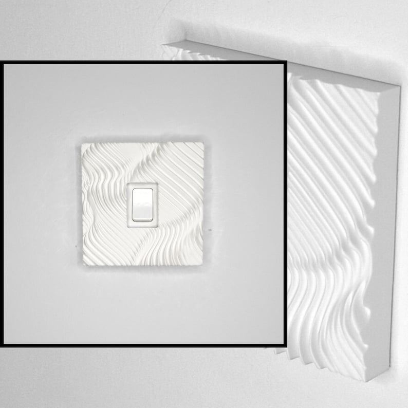 May include: A white light switch cover plate featuring a textured, wavy, three-dimensional pattern across its entire surface. The square plate surrounds a single, centered, rectangular white rocker switch toggle, creating a tactile design.