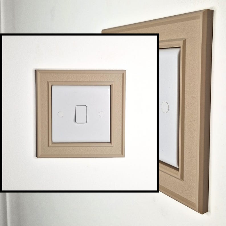 May include: A white square light switch featuring a single vertical toggle, centered within a decorative beige wall plate. The plate has a textured surface and a stepped, beveled frame design, shown from both a front-facing and a side angle.