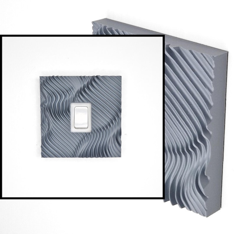 May include: A square light switch cover plate featuring a grey, three-dimensional wavy, rippled texture across its surface. The cover plate has a centered rectangular cutout containing a standard white rocker-style light switch toggle.