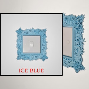 May include: An ice blue light switch cover with a floral design. The cover is square with a rectangular opening for the switch. The text "ICE BLUE" is in red at the bottom of the image.