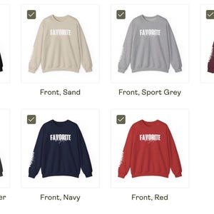 May include: A selection of crew neck sweatshirts in colours such as black, sand, sport grey, maroon, dark heather, navy, and red. Each sweatshirt displays the word "FAVORITE" in white block letters on the front and a design on the left sleeve.