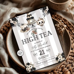 May include: High tea invitation with a striped background. The invitation features illustrations of cakes and a skull-shaped teapot. Text includes "High Tea", the date, and location. Floral accents in black and white complete the design.