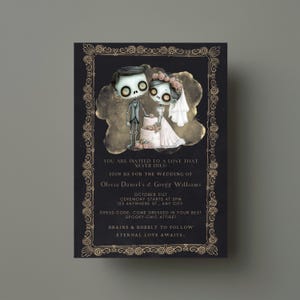 May include: A black and gold wedding invitation with a cartoon illustration of a skeleton couple. The text reads "You are invited to a love that never dies! Join us for the wedding of Olivia Daniel's & Gregg Williams. October 31st. Ceremony starts at 5pm. 123 Anywhere St., Any City. Dress code: Come dressed in your best spooky-chic attire! Brains & bubbly to follow. Eternal love awaits."