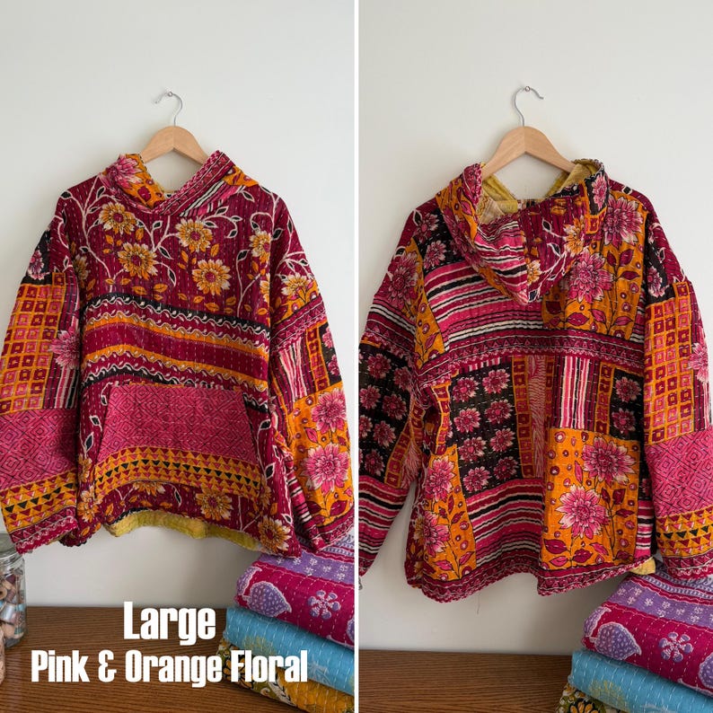 May include: A white ceramic mug with a black handle and the text "But First, Coffee" in a bold, black font. The mug is set against a blurred background, suggesting a cozy setting.