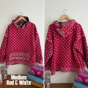 May include: A white ceramic mug with a black handle and the text "But First, Coffee" in a handwritten style. The mug is on a white surface. The mug is 4 inches tall.