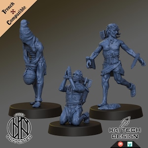 May include: Three gray miniature figures on black bases. One figure is bent over, carrying a sack. Another kneels with hands bound. The third figure is running with a knife. Text reads "Trench Compatible" and "Kai Tech Design."