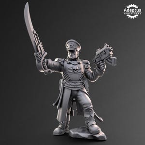 May include: A grey miniature figure of a military officer holding a large sword and a pistol. The officer wears a uniform with a skull emblem and a peaked cap. The figure is standing on a small rock. The figure is a miniature.