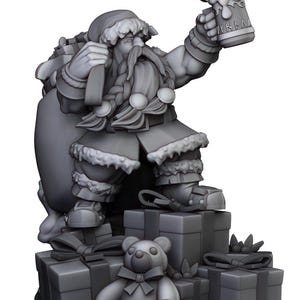 May include: A grey painted miniature figurine of a bearded, jolly, Santa Claus-like figure holding a beer stein. He is wearing a red and white suit with a fur trim and a large sack on his back. He is standing on a stack of grey painted gift boxes with a grey teddy bear in front of him.