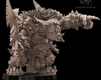 May include: A detailed, gray-toned miniature of a Black Orc Warboss, a fantasy figure. The orc is heavily armored, with spiked shoulder pads and a large weapon. The figure is posed with one arm extended, pointing. Text at the base reads "Black Orc Warboss".