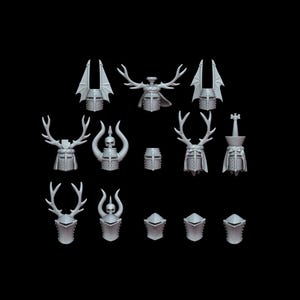 May include: A set of 12 miniature knight helmets with various designs, including horned, winged, and skull-topped helmets. The helmets are made of a gray plastic material and are suitable for tabletop gaming or miniature painting.