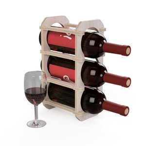May include: A wooden wine rack holding three bottles of red wine with burgundy labels and dark red corks. A wine glass with red wine sits to the left of the rack. The rack is made of light-colored wood.