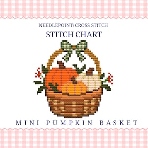 Op de afbeelding: Een kruissteekpatroon met de titel MINI PUMPKIN BASKET. Het ontwerp toont een bruine gevlochten mand gevuld met oranje en witte pompoenen, groene bladeren en rode bessen, bekroond met een groen-wit geblokte strik.