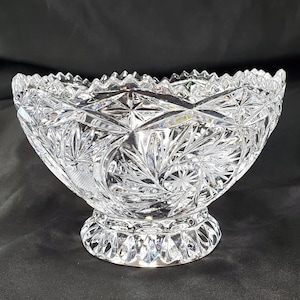 May include: A set of three ceramic mugs with a speckled, matte finish. The mugs are in shades of cream, light gray, and dark gray. Each mug has a simple, minimalist design and a rounded handle.