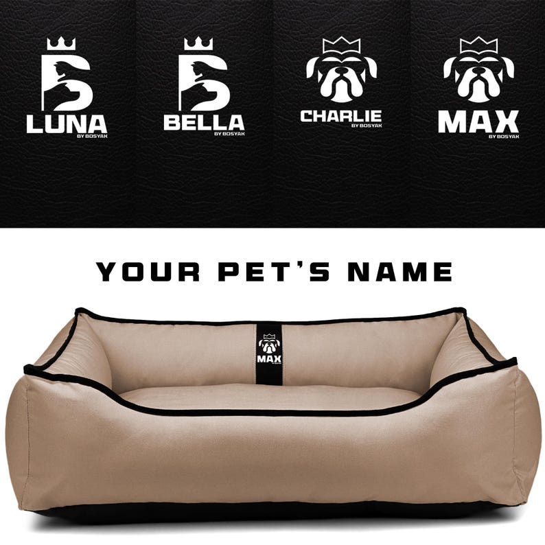 May include: A tan pet bed with black trim and a black base. The bed has a rectangular shape with rounded corners. Above the bed are logos with pet names: Luna, Bella, Charlie, and Max. The text "YOUR PET'S NAME" is above the bed.