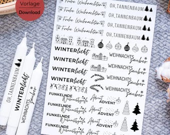 May include: A sheet of black and white Christmas themed stickers with phrases like "Winterlicht", "Weihnachtszauber", "Oh, Tannenbaum", and "Frohe Weihnachten".