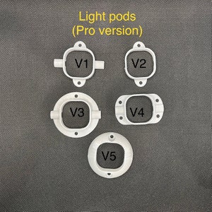 Op de afbeelding: Vijf witte lichtpod-houders, gelabeld V1 tot en met V5, zijn gerangschikt op een donkergrijze ondergrond. De tekst "Light pods (Pro version)" staat bovenaan. Elke houder heeft een unieke vorm, met montagegaten.