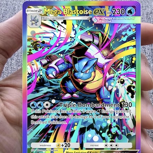 May include: A holographic Mega Blastoise EX Pokémon card. The card features a blue Blastoise with a colorful background of pink, blue, and yellow. The card text includes "Triple Bombardment 130" and "Mega Evolution EX rule".