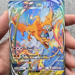 ash's charizard pokemon card gorillacards Hitting us right in the feels today with this sad custom card. This custom card pays homage to the moment our hero, Ash Ketchum, let his Charizard free to train