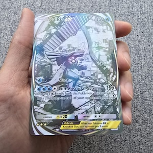 May include: A holographic Pokemon trading card featuring Palkia EX with a blue and silver background. The card has a power attack called "Dimensional Storm" that does 150 damage and requires discarding 3 energy from the Pokemon. The card also has a slash attack that does 30 damage.