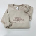 I'm booked EMBROIDERED Sweatshirt, Sorry Bookish Sweatshirt, Librarian Gift, Gift for Book Lovers, Book Lover Shirt, Reading Gift for Her product logo