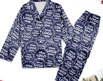 May include: A navy blue pajama set with a long-sleeved shirt and pants. The fabric features a repeating pattern of white circles with the text "Your Logo Here" inside each circle.