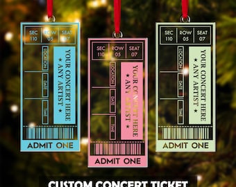 May include: Three custom concert ticket ornaments in blue, pink, and green, each with a red ribbon for hanging. The tickets have sections for location, date, and time, with the text "Your Concert Here * Any Artist *" and "Admit One."