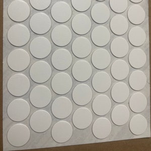 May include: A sheet of white adhesive-backed circles, perfect for crafts, home decor, or organizing.