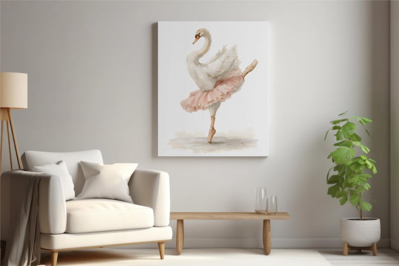 May include: A canvas print showing a watercolour painting of a swan in a ballet pose. The swan has white feathers and a pink tutu, set against a neutral background. The artwork is displayed in a living room setting, with a sofa and a plant.