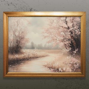 May include: A framed painting depicting a landscape with a winding river flowing through a field of pink flowers and trees. The painting is in a gold frame.