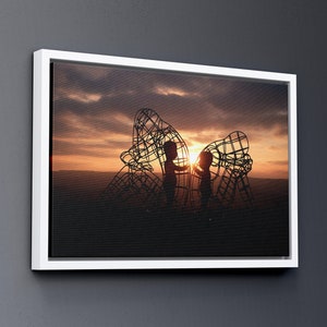 May include: Silhouette of two children standing inside a large metal sculpture against a sunset sky.