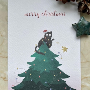 Weihnachtskarte-  Katze auf Tannenbaum mit Schriftzug Merry Christmas, Postkarten zu Weihnachten im Format A6