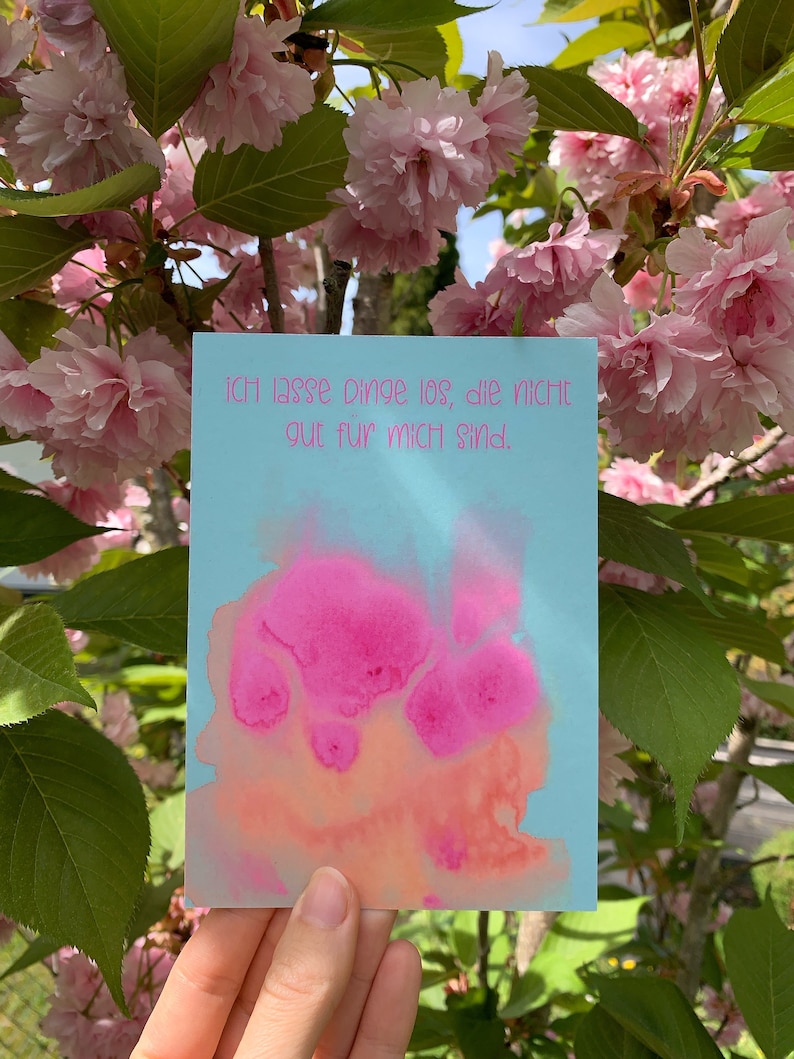 May include: A light blue card with pink watercolor splatter and the text "Ich lasse Dinge los, die nicht gut f&uuml;r mich sind."